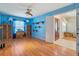 Living room with wood floors and views into the foyer at 13931 Chandron Dr, Odessa, FL 33556