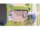 Aerial view of house, pool, and backyard, located on a canal at 13931 Chandron Dr, Odessa, FL 33556