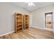 Bedroom with two bookshelves and wood flooring at 13931 Chandron Dr, Odessa, FL 33556