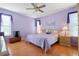 Large bedroom with king-size bed, nightstands, and ceiling fan at 13931 Chandron Dr, Odessa, FL 33556