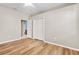 Simple bedroom with wood flooring and access to bathroom at 13931 Chandron Dr, Odessa, FL 33556