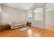 Living room features hardwood floors and a view into dining area at 13931 Chandron Dr, Odessa, FL 33556