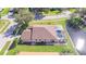 House with brown roof and screened pool at 13931 Chandron Dr, Odessa, FL 33556
