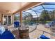 Spacious screened pool and patio area with fire pit at 13931 Chandron Dr, Odessa, FL 33556