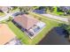 House with brown roof and pool near pond at 13931 Chandron Dr, Odessa, FL 33556