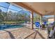Relaxing screened pool area with patio furniture at 13931 Chandron Dr, Odessa, FL 33556