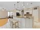 Spacious kitchen with white cabinets, granite counters and island at 13931 Chandron Dr, Odessa, FL 33556