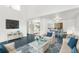 Open living space with kitchen and dining area, featuring a modern design at 10221 Elgin Blvd, Spring Hill, FL 34608