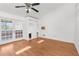 Spacious living room featuring hardwood floors and built-in shelving at 10221 Elgin Blvd, Spring Hill, FL 34608