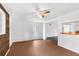 Room with wood-paneled accent wall, tile floor and door to outside at 10221 Elgin Blvd, Spring Hill, FL 34608