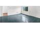 Room with tile floors, white walls, and exterior view at 10221 Elgin Blvd, Spring Hill, FL 34608