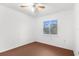 Simple bedroom with ceiling fan and large window, offering natural light at 10221 Elgin Blvd, Spring Hill, FL 34608
