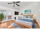Bright main bedroom with hardwood floors and French doors at 10221 Elgin Blvd, Spring Hill, FL 34608