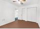 Bright bedroom with ceiling fan, double closets and neutral decor at 10221 Elgin Blvd, Spring Hill, FL 34608