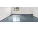 Room with tile floors, white walls, and exterior access at 10221 Elgin Blvd, Spring Hill, FL 34608