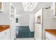 Kitchen with white appliances, wood countertops, and view into living area at 10221 Elgin Blvd, Spring Hill, FL 34608