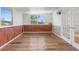 Sunroom with wood flooring and large windows at 10221 Elgin Blvd, Spring Hill, FL 34608