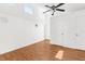 Well-lit bedroom with hardwood floors and double closets at 10221 Elgin Blvd, Spring Hill, FL 34608