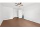 Simple bedroom with ceiling fan and neutral walls at 10221 Elgin Blvd, Spring Hill, FL 34608