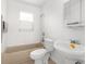 Clean bathroom with white sink, bathtub, and tiled walls at 10221 Elgin Blvd, Spring Hill, FL 34608