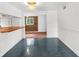 Empty dining room with wood-paneled accent wall and tile floors at 10221 Elgin Blvd, Spring Hill, FL 34608