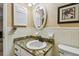 Simple bathroom with granite countertop, white sink, and oval mirror at 1847 Shore S Dr # 614, South Pasadena, FL 33707