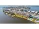 Aerial view of waterfront condo building with parking and surrounding buildings at 1847 Shore S Dr # 614, South Pasadena, FL 33707