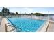 Community pool with water access and patio at 1847 Shore S Dr # 614, South Pasadena, FL 33707