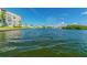 Waterfront view of calm waters, neighboring buildings, and lush greenery at 1847 Shore S Dr # 614, South Pasadena, FL 33707
