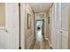 Long hallway with light wood flooring, leading to other rooms at 1847 Shore S Dr # 614, South Pasadena, FL 33707