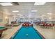 Spacious community room with pool table and seating at 1847 Shore S Dr # 614, South Pasadena, FL 33707