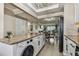 Updated kitchen with white cabinets, granite countertops, and stainless steel appliances at 1847 Shore S Dr # 614, South Pasadena, FL 33707