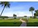 Serene waterfront view with a dock and lush landscaping at 1847 Shore S Dr # 614, South Pasadena, FL 33707