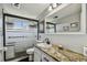 Bathroom with granite countertop and walk-in shower at 1847 Shore S Dr # 614, South Pasadena, FL 33707