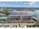 Aerial view of waterfront condo building with parking lot and surrounding area at 1847 Shore S Dr # 614, South Pasadena, FL 33707