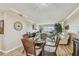 Bright dining area with glass-top table and wicker chairs at 1847 Shore S Dr # 614, South Pasadena, FL 33707