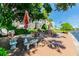Outdoor waterfront seating area with picnic tables and grill at 1847 Shore S Dr # 614, South Pasadena, FL 33707