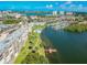Aerial view showcasing waterfront property, marina, and city skyline at 1847 Shore S Dr # 614, South Pasadena, FL 33707