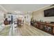 Open living room features wood flooring and a view into the kitchen and dining areas at 1847 Shore S Dr # 614, South Pasadena, FL 33707