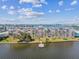 Aerial view of waterfront condo building with pool, dock, and lush landscaping at 1847 Shore S Dr # 614, South Pasadena, FL 33707
