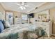 Main bedroom with coastal decor and TV at 1847 Shore S Dr # 614, South Pasadena, FL 33707