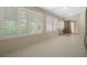 Bright sunroom with white shutters at 9306 Southern Belle Dr, Weeki Wachee, FL 34613