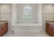 Bathroom features a large soaking tub and double vanity at 9306 Southern Belle Dr, Weeki Wachee, FL 34613