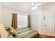 Bedroom with a ceiling fan and large window at 8088 Spanish Oak Dr, Spring Hill, FL 34606