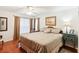Spacious Primary bedroom with large windows and hardwood floors at 8088 Spanish Oak Dr, Spring Hill, FL 34606