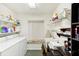 Laundry room with washer, dryer, shelving and workspace at 8088 Spanish Oak Dr, Spring Hill, FL 34606