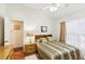 Bedroom with wood floors and ceiling fan at 8088 Spanish Oak Dr, Spring Hill, FL 34606