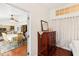 Bedroom with wood floors and view into dining room at 8088 Spanish Oak Dr, Spring Hill, FL 34606