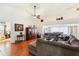 Living room with hardwood floors, sectional sofa and high ceilings at 8088 Spanish Oak Dr, Spring Hill, FL 34606