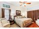 Spacious Primary bedroom with hardwood floors and large windows at 8088 Spanish Oak Dr, Spring Hill, FL 34606